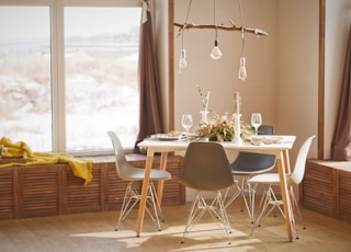 white wooden dining table set during daytime