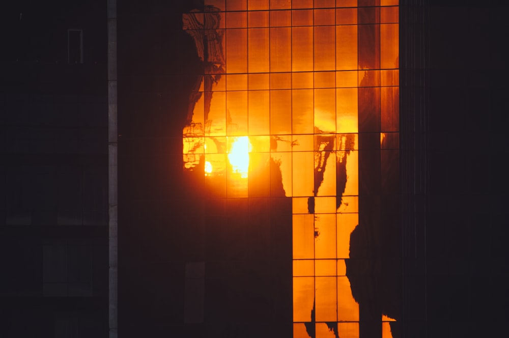 the reflection of a building in the windows of another building