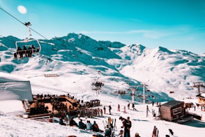 crowd gathered on snowy mountain park