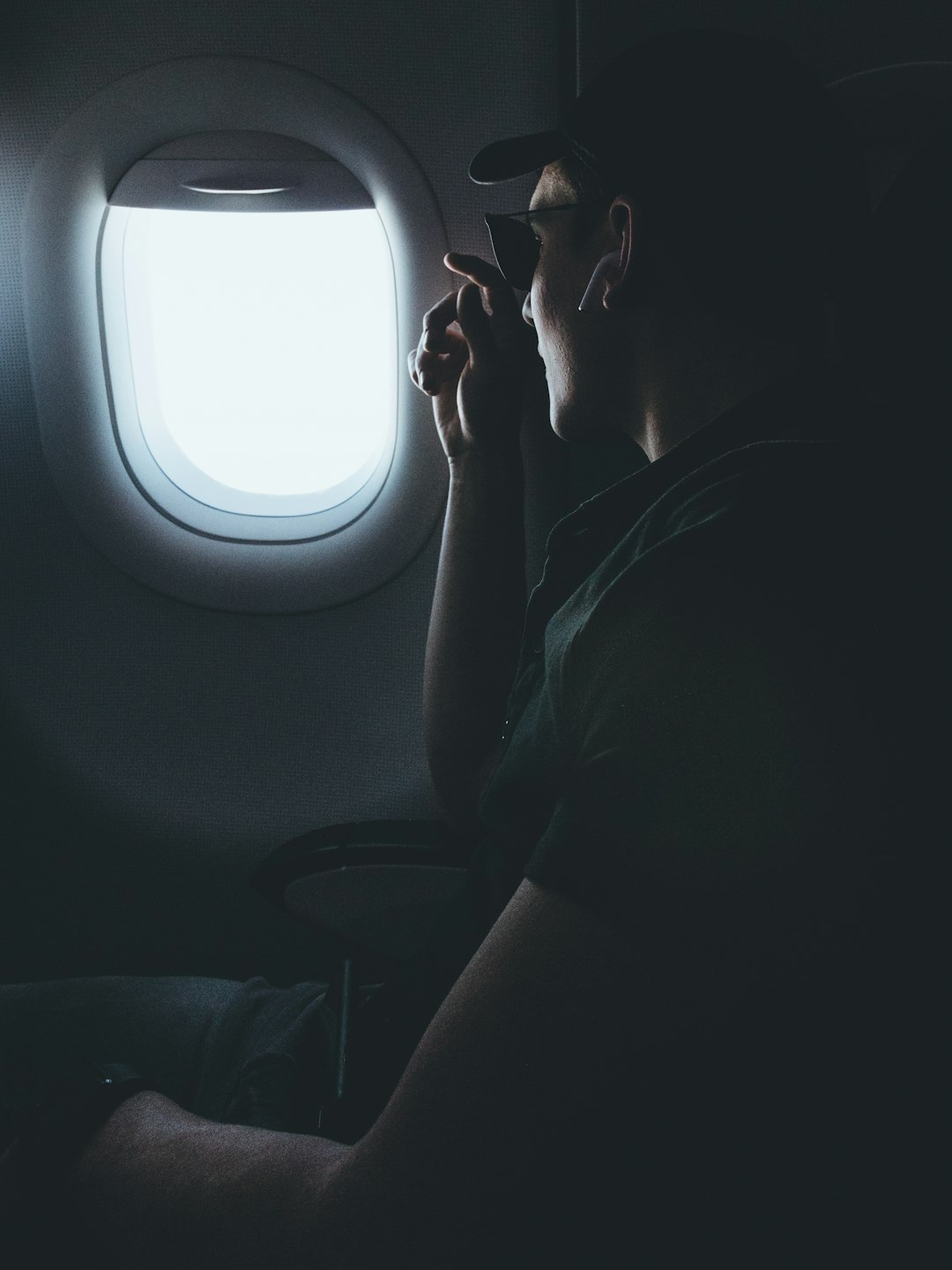 man inside airplane sitting on chair