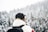 person wearing black cap and backpack bokeh photography