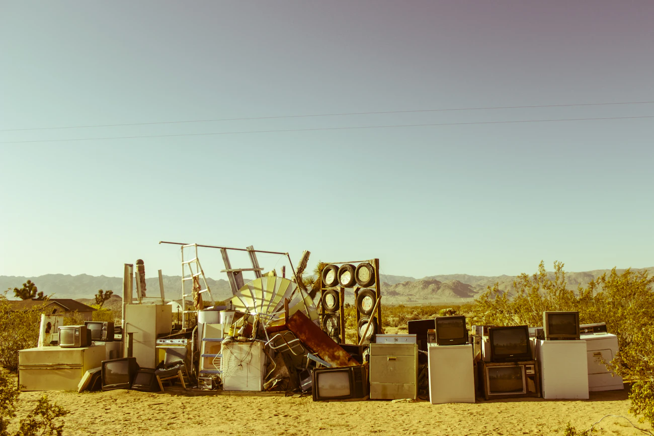 An old household appliance sitting outdoors, ready to be removed