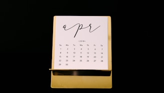 white calendar on brown rack