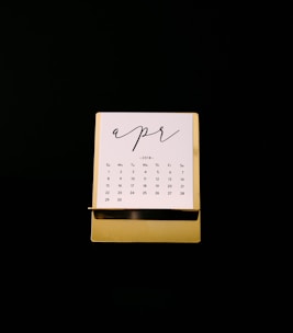 white calendar on brown rack