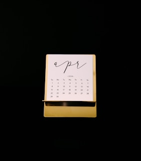 white calendar on brown rack