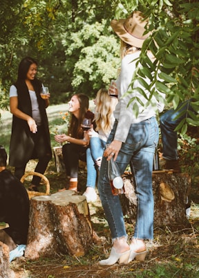 group of women in forest drinking