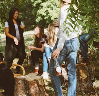 group of women in forest drinking