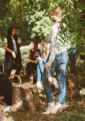 group of women in forest drinking