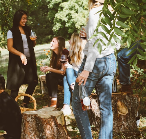 group of women in forest drinking