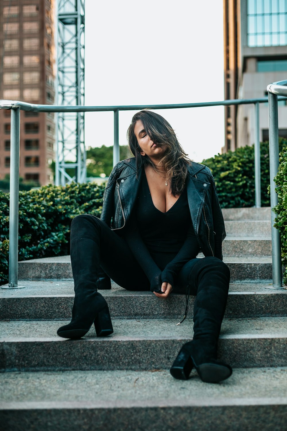 woman sitting in grey stair