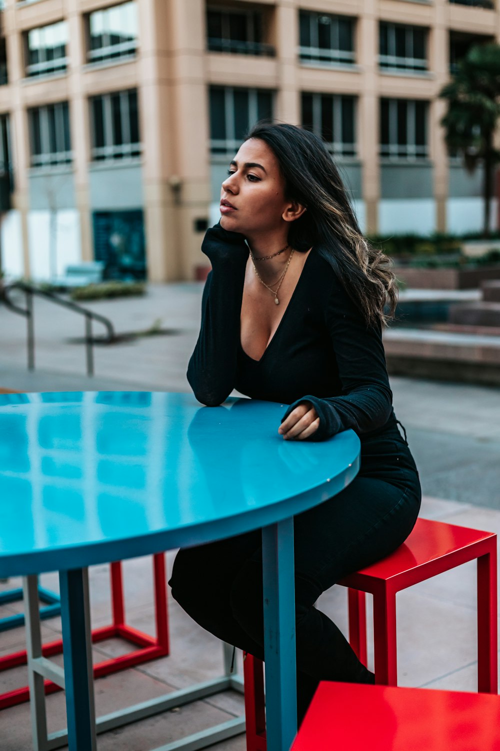 woman sitting on red chair