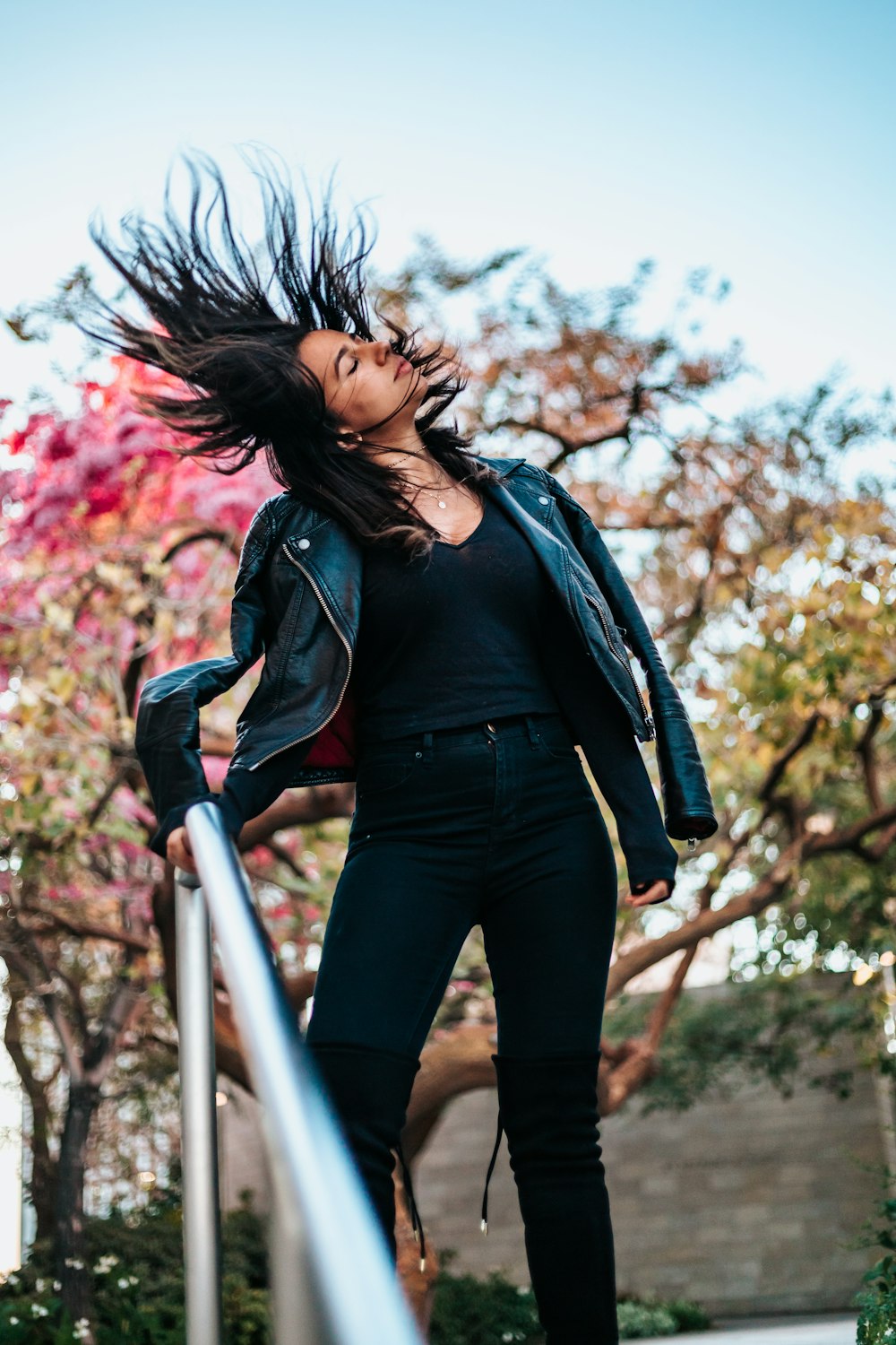 standing woman doing hair flick