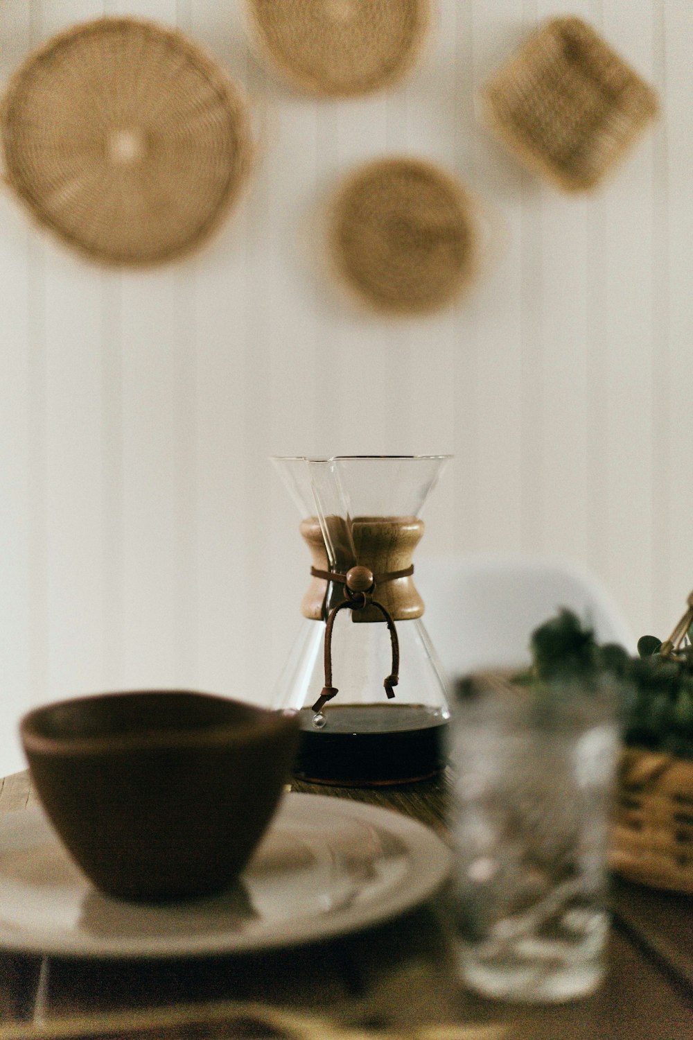 selective focus photo of clear glass container