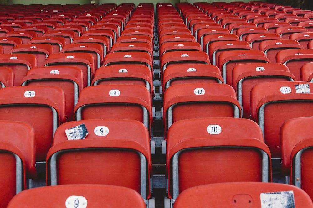 red chairs close up photography