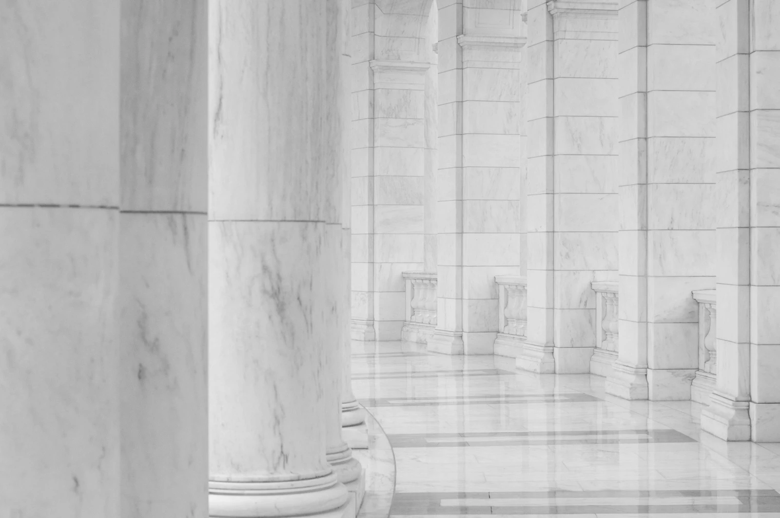 Minimalist hallway between stone columns