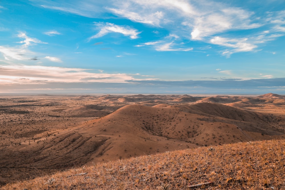 mountain ranges under the cloudy skies