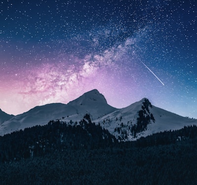 snow mountain under stars