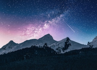 snow mountain under stars