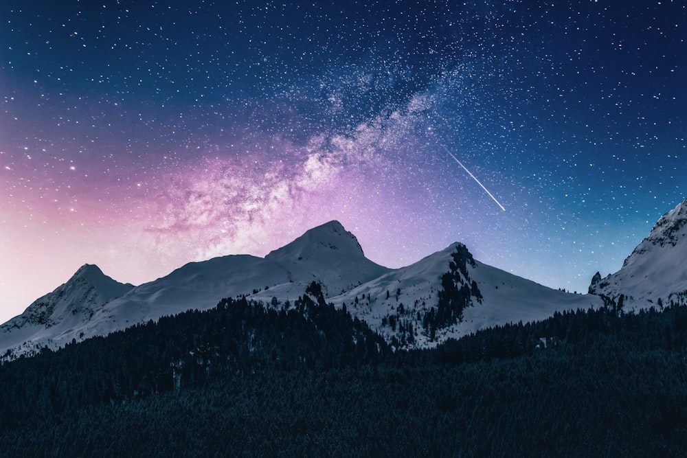 snow mountain under stars