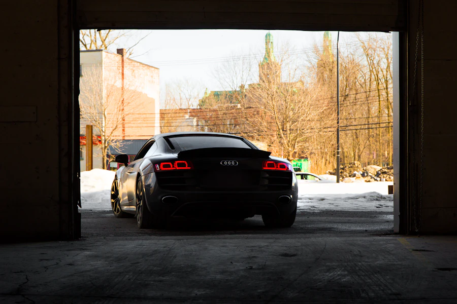 Silver sports car leaving a studio with a polished finish