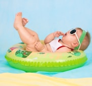 baby lying on inflatable ring