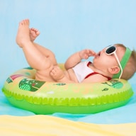 baby lying on inflatable ring