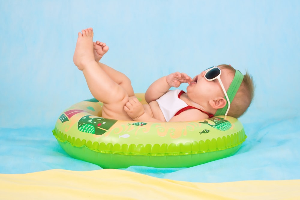 baby lying on inflatable ring