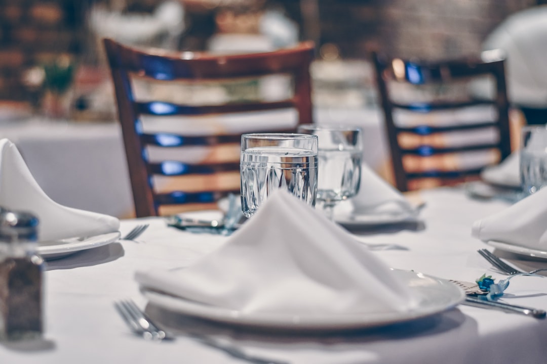 clear glass cup on table,