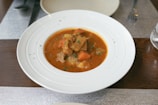 A steaming bowl of hearty English stew.