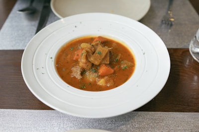 A steaming bowl of hearty English stew.