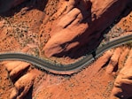 aerial photography of concrete road near rock mountain