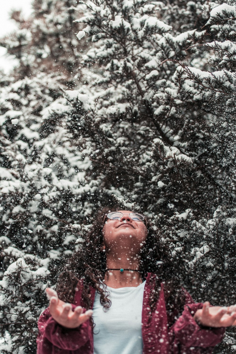 girl leaning above during with snow