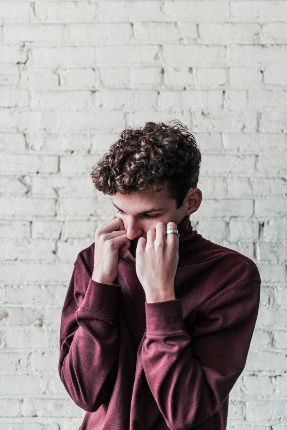 man wearing maroon sweater