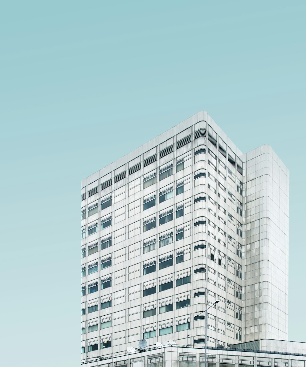 architectural photography of white concrete high-rise building