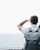 a man with a backpack looking out at the ocean