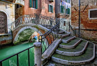 orange and gray stone bridge during daytime