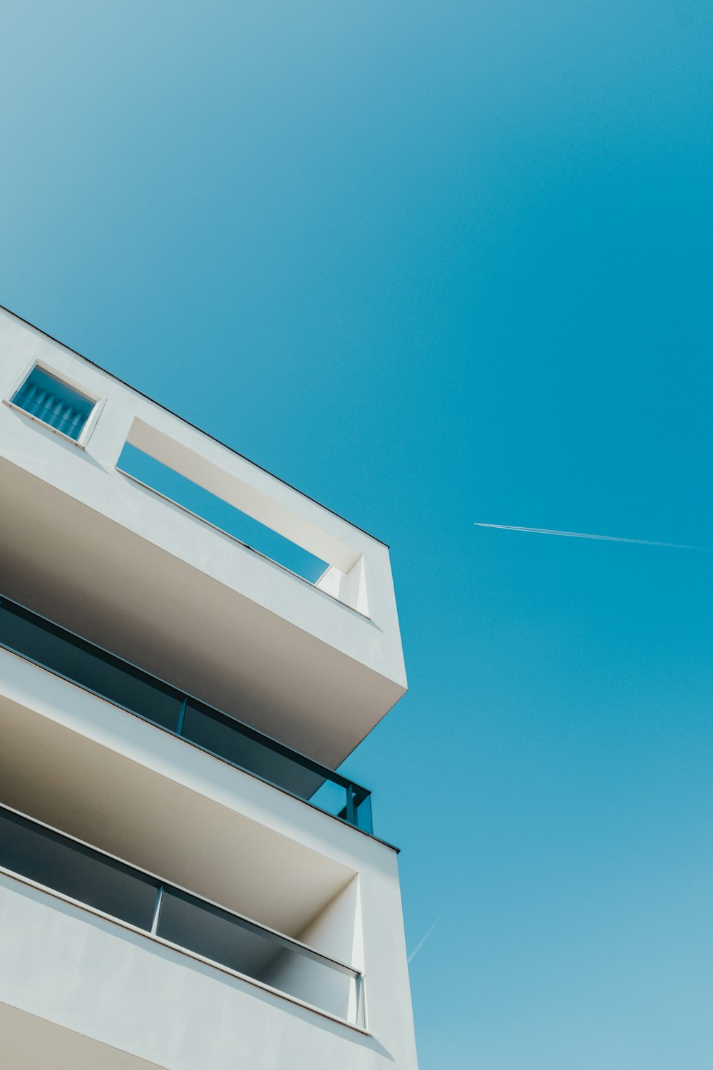 low-angle photography of white building