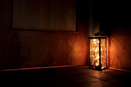 A cozy room softly lit by a handcrafted lantern from Wolf Innovations Inc.