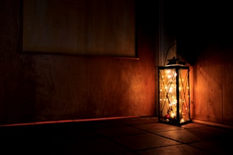 Traditional Islamic lanterns glowing warmly in a dimly lit room.