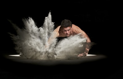 sports photography,how to photograph powerful man; man smash the ground