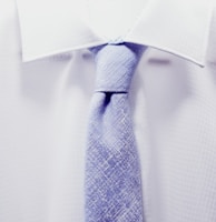 close up photo white collared shirt with blue necktie