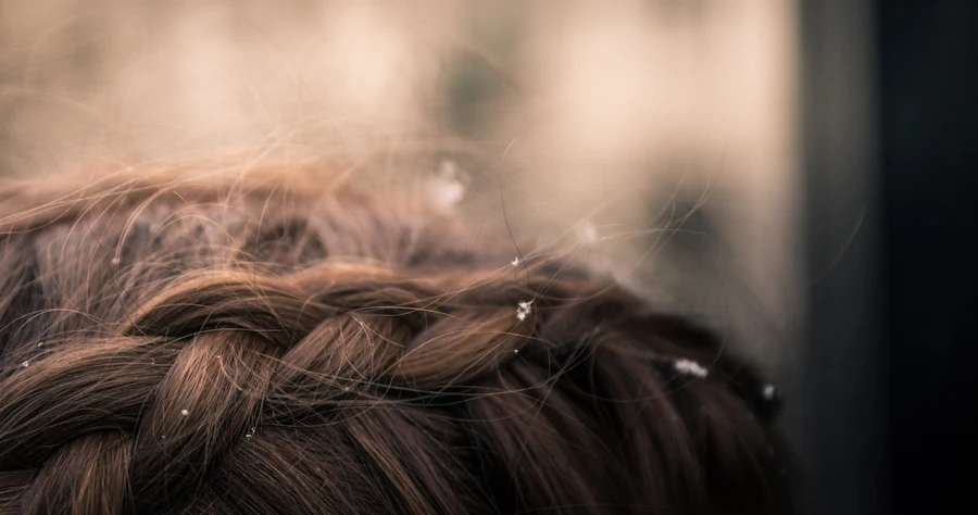 A close view of soft brown hair loosely braided.
