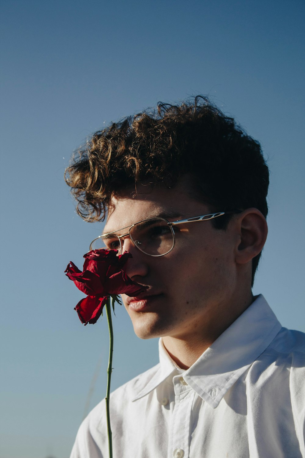 man holding red rose