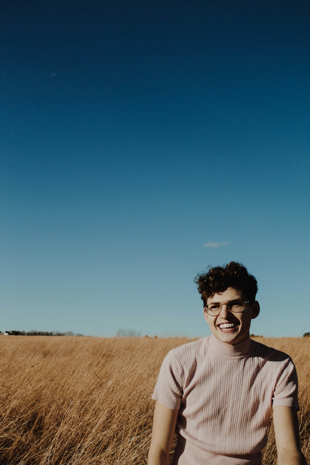 man on grassland during daytime