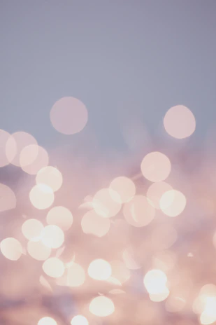 soft pink bokeh lights against gray background