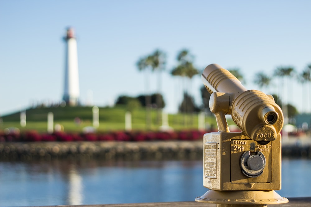 brass-colored coin operated telescope