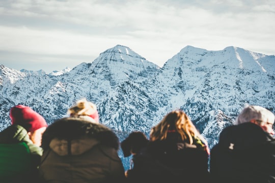 four people viewing snowy mountain during daytime in Unternberg Germany
