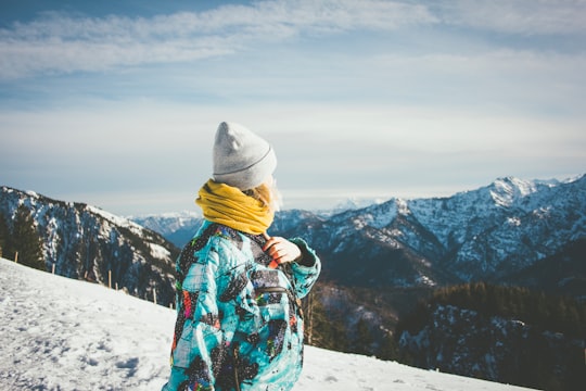 person on top of snow-covered mountain in Unternberg Germany