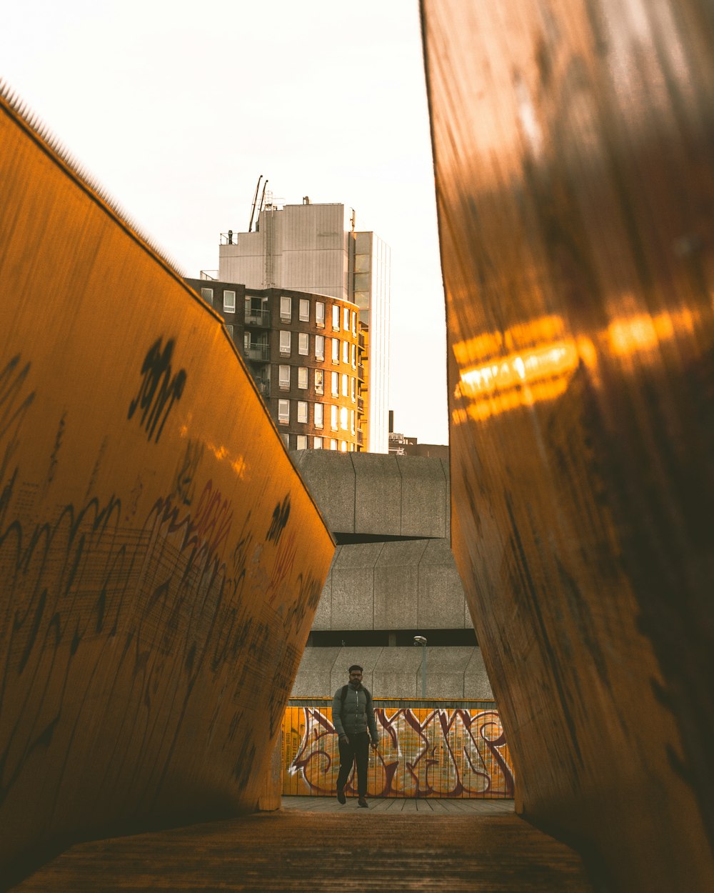 man walking inward hallway