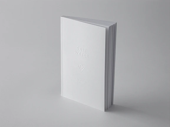 Close-up of a minimalist book cover featuring clean typography and soft colors.